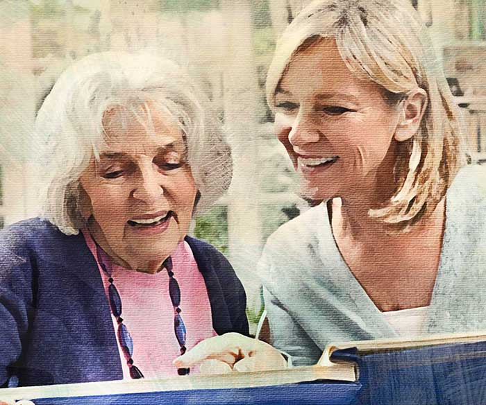 Two women looking at a book.