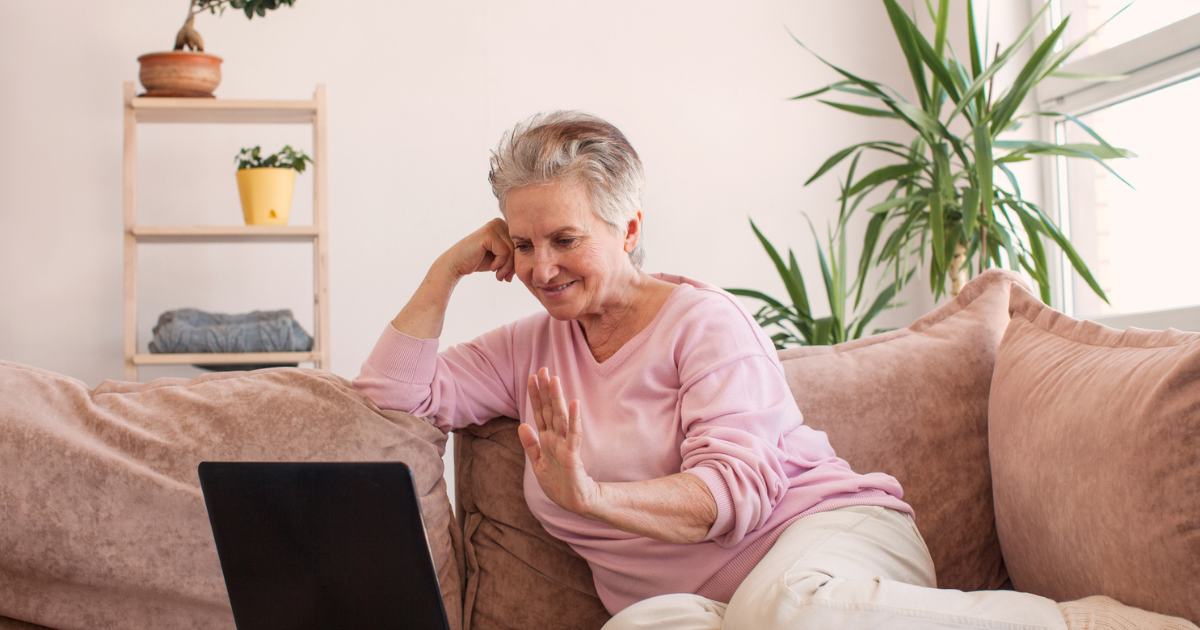 Elder woman sitting on sofa enjoying her quality of life