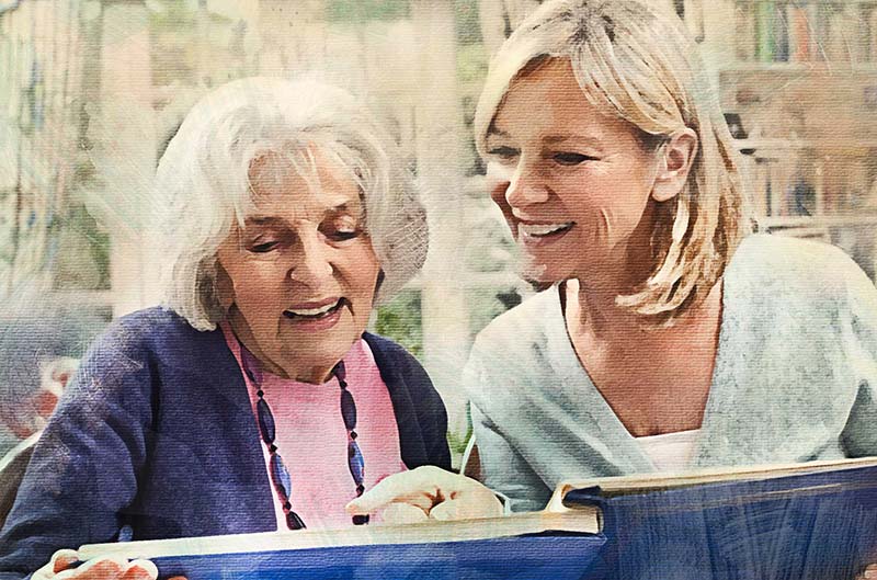 Picture of two women looking at a book.