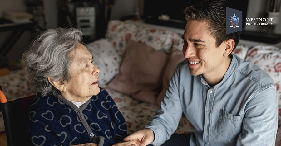 Young man and elderly woman talking about Dementia