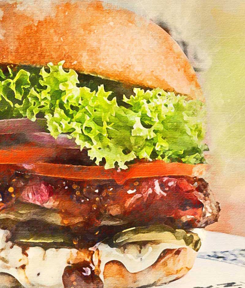 Artistic image of a burger with lettuce. tomato, and onion